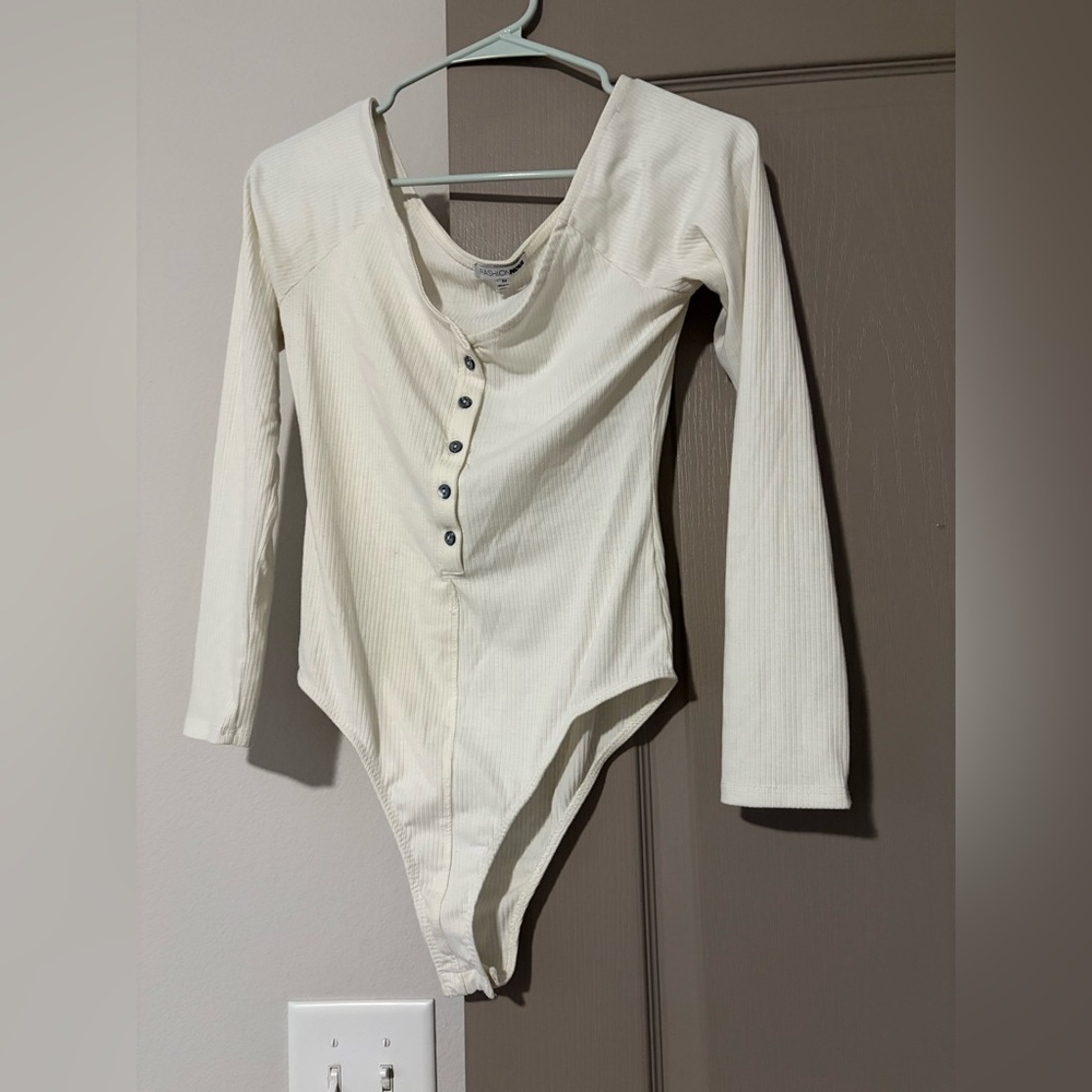 Long Sleeve Ribbed One-Piece Bodysuit in Cream